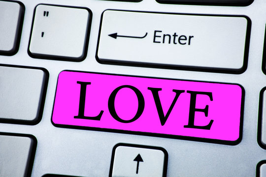 Text sign showing Love. Conceptual photo Intense feeling Deep affection Romantic Sexual attachment Relationship written on Pink Key Button on White Keyboard with copy space. Top view.