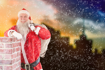 Portrait of Santa Claus carrying bag full of gifts against cityscape during sunset