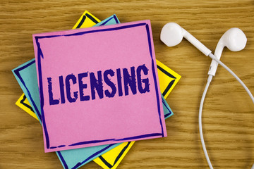 Conceptual hand writing showing Licensing. Business photo showcasing Grant a license Legally permit...