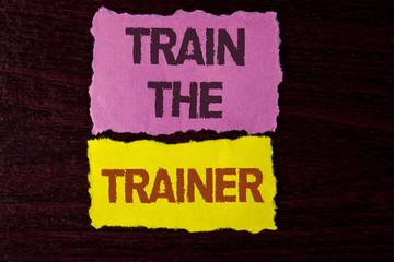 Writing note showing  Train The Trainer. Business photo showcasing Learning Technique Students being teachers themselves written on Tear Sticky Note Papers on the wooden background.
