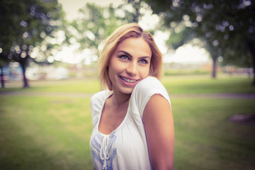 Happy woman standing in park