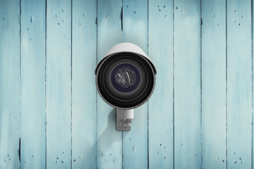 CCTV camera against wooden planks