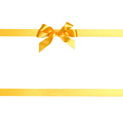 Festive golden gift ribbon and bow isolated on white background cutout