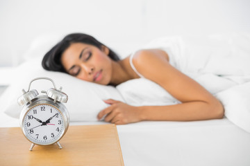 Calm beautiful woman sleeping lying in her bed 