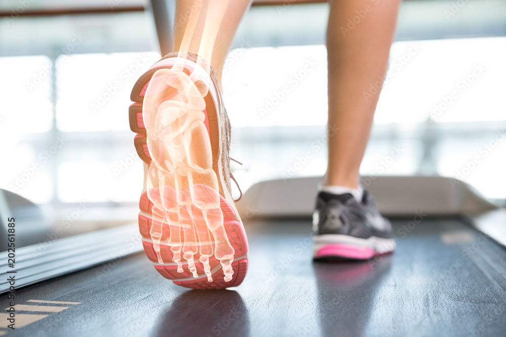 Wall mural highlighted foot of woman on treadmill