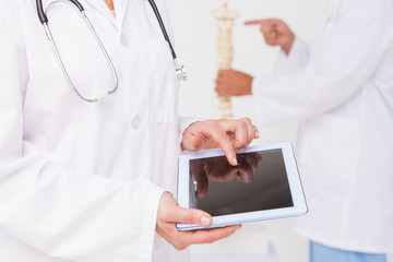 Doctor using tablet pc