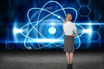 Thinking businesswoman against blue glowing technology interface