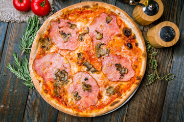 Pizza with ham and mushrooms