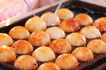 Takoyaki is delicious Japanese food on pan