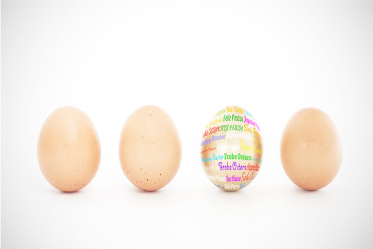 Happy easter in different languages against four eggs in a row with one gold one