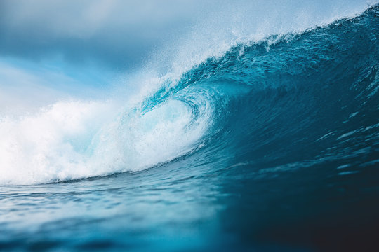 Ocean blue wave in ocean. Breaking wave for surfing in Bali