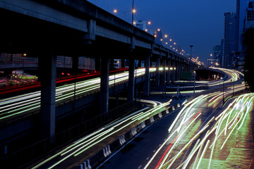Fototapeta na wymiar Speed Traffic - light trails on the road at night, long exposure