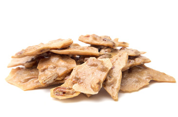 Homemade Pecan Brittle on a White Background