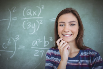 Schoolgirl pretending to be a teacher in classroom