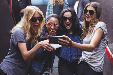 Female friends looking at smartphone