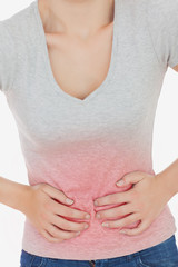 Woman suffering from stomach against white background