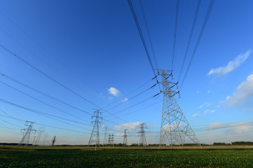 High voltage tower, in the sky background