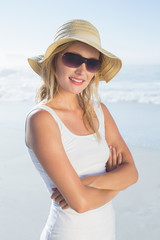 Fototapeta na wymiar Gorgeous happy blonde posing at the beach
