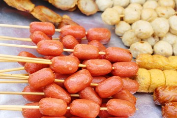Fried meatballs and sausage at street food