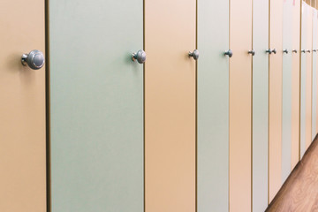 Wooden multi-colored lockers with handles in the school for young children