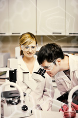 Science and medical graphic against scientists holding clipboard and looking through a microscope