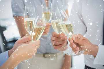 Composite image of Hands toasting with champagne against snow