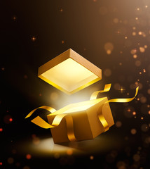 Gold open gift box with magical light