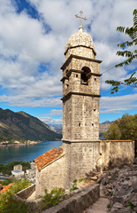Fototapeta na wymiar Montenegro. Kotor. The beautiful 15th-century Church of Our Lady of Remedy (Crkva Gospa od Zdravlja) with stone dome on the bell tower (UNESCO-protected)
