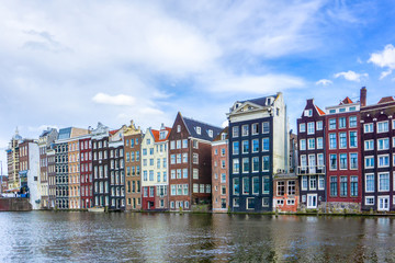 Colorful traditional old buildings in sunshine day at Amsterdam, Netherlands
