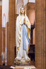 Pavia, Italy. December 2 2017. The statue of Our Lady of Lourdes in the "Santa Maria del Carmine" church (Holy Mary of Carmel)