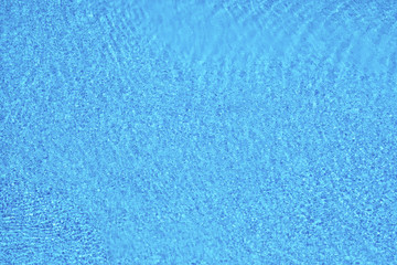 Fototapeta na wymiar Blue pool surface. Summer vacations background.