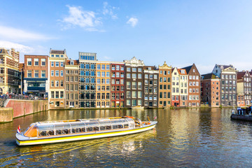 Naklejka premium Colorful traditional old buildings in sunshine day at Amsterdam, Netherlands