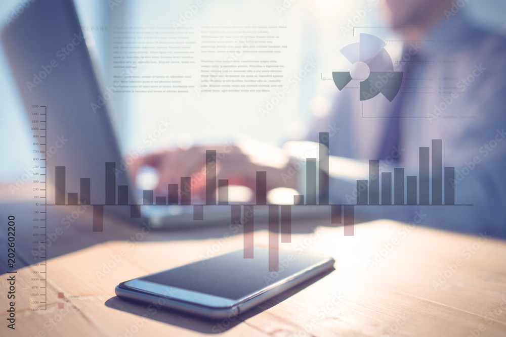 Poster business interface with graphs and data against businessman using laptop at desk