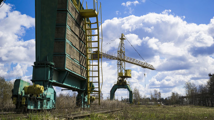 Old, rusty gantry crane, an abandoned plant. Collapse of economy, and shutdown of production...
