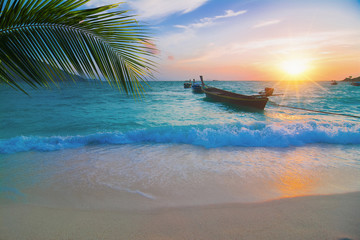 Fototapeta na wymiar Sunrise with long tale boat on colorful sea beach and blue sky at Lipe Island Thailand , beautiful beach, summer concept, sea and sand, traveling,wave