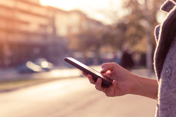 Using mobile phone on the street.
