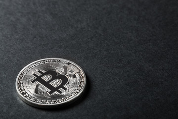 bitcoin coin on a black background. bitcoin is the most popular cryptocurrency in the world.