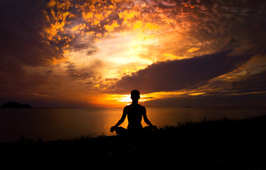 Serenity and yoga practicing at sunset,meditation