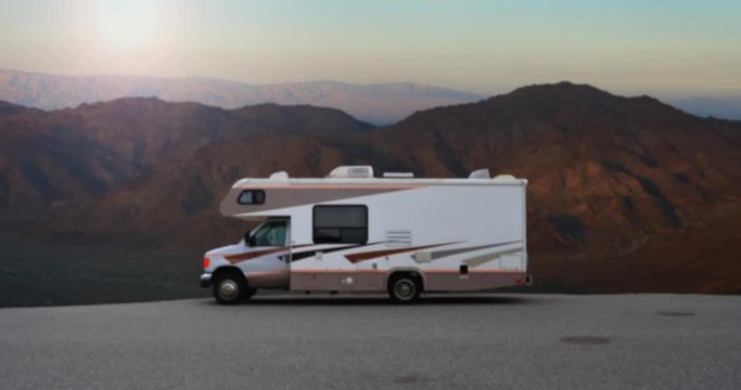 Retro RV Camper In The Californian Desert Wilderness At Sunrise