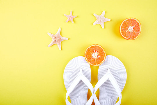 White Flip flops, Orange fruit, starfish