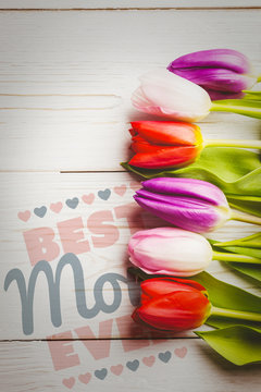 best mom ever against tulips on table