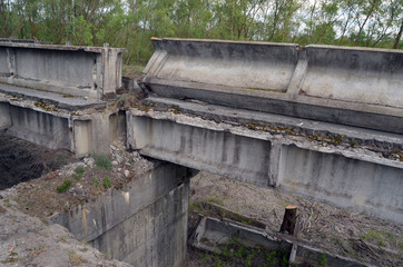 Fototapeta na wymiar 7 km. near Chernobyl area border. Ruined Bridge. Kiev region. Ukraine 