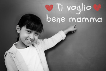 Italian mothers day message against schoolchild with blackboard