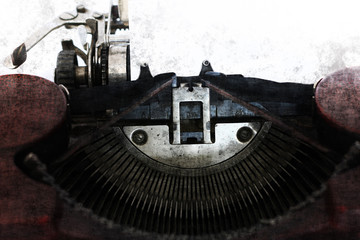Blank paper in the old typewriter machine in grunge style