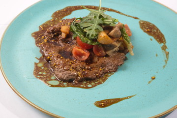Warm beef salad on plate