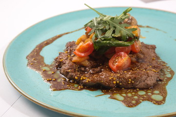 Warm beef salad on plate