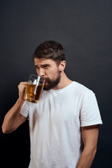 man with a beer at gray background