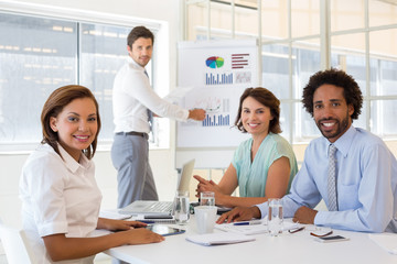 Businessman giving presentation to colleagues