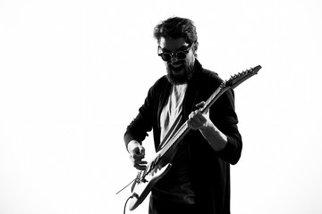 man playing guitar on light background