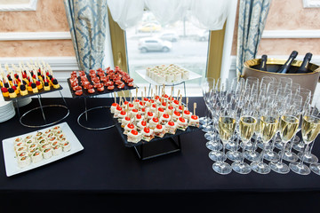 Table with wine glasses, canape
